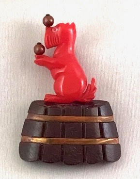 BP80 red bakelite circus dog pin